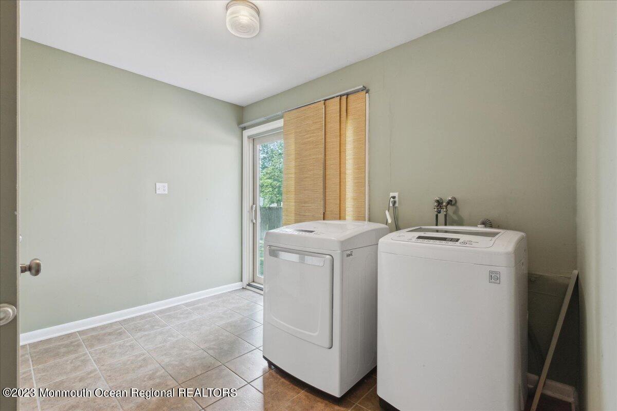 136 Lancaster Road Freehold, NJ 07728 - Photo 18 of 44 a utility room with dryer and washer