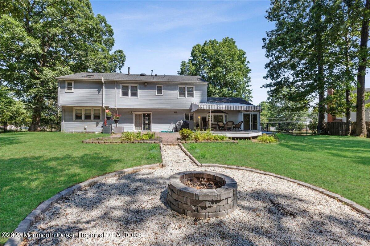 136 Lancaster Road Freehold, NJ 07728 - Photo 33 of 44 a view of a house with a yard porch and sitting area