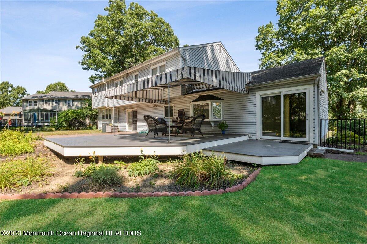 136 Lancaster Road Freehold, NJ 07728 - Photo 35 of 44 a front view of a house with swimming pool having outdoor seating