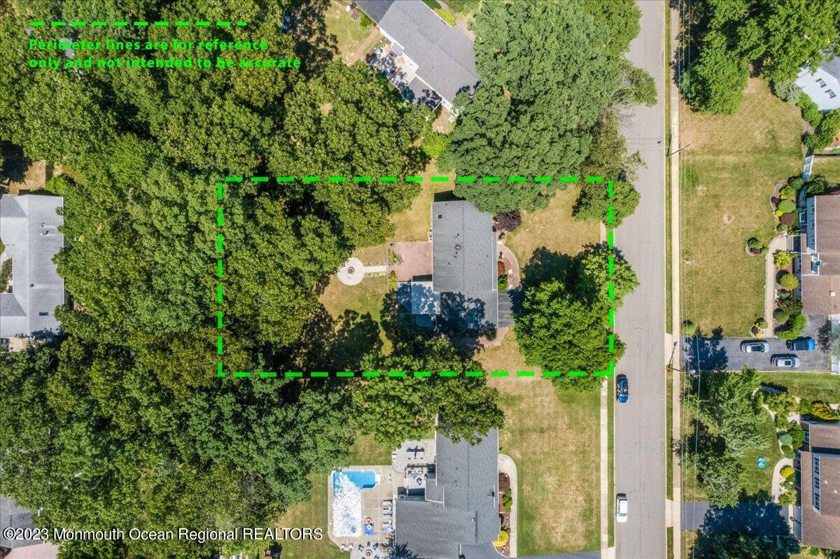 136 Lancaster Road Freehold, NJ 07728 - Photo 40 of 44 an aerial view of a house with a yard and garden