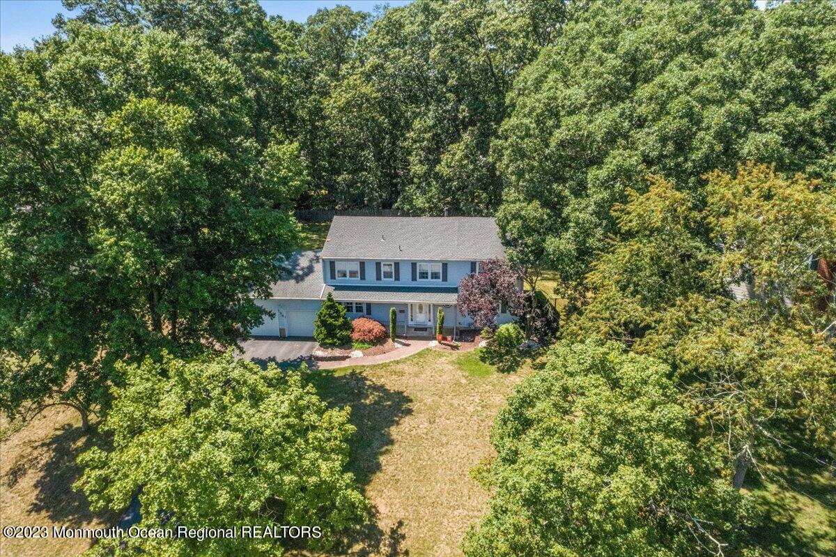 136 Lancaster Road Freehold, NJ 07728 - Photo 42 of 44 a view of a house with a yard