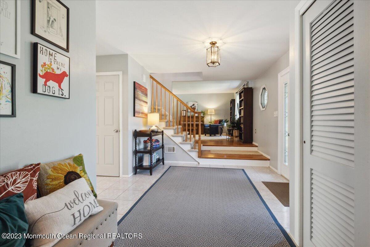 136 Lancaster Road Freehold, NJ 07728 - Photo 5 of 44 a view of a living room and bathroom