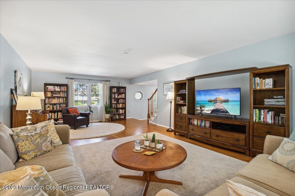 136 Lancaster Road Freehold, NJ 07728 - Photo 8 of 44 a living room with furniture and a flat screen tv