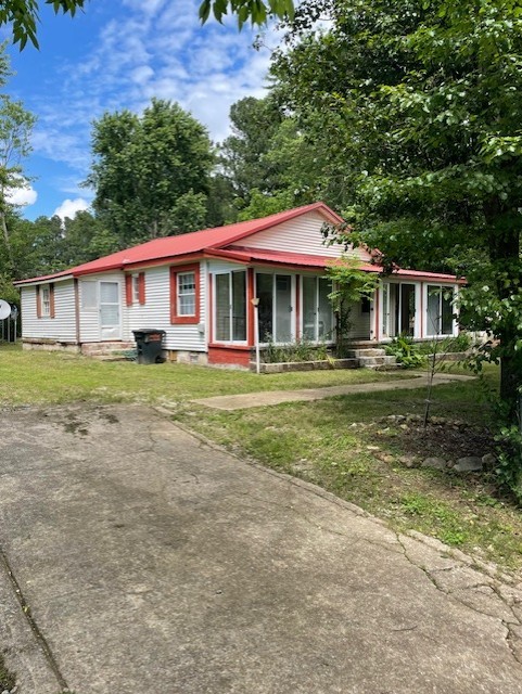 103 East High Street Ethridge, TN 38456 - Photo 3 of 14 a front view of a house with a yard table and chairs