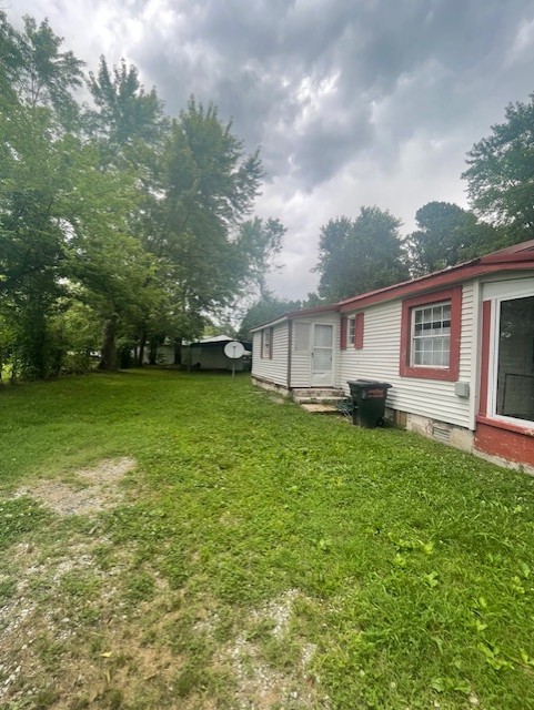 103 East High Street Ethridge, TN 38456 - Photo 8 of 14 a front view of a house with garden