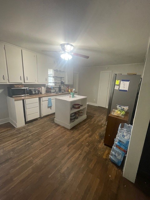 103 East High Street Ethridge, TN 38456 - Photo 9 of 14 a room with kitchen island granite countertop a sink cabinets and wooden floor