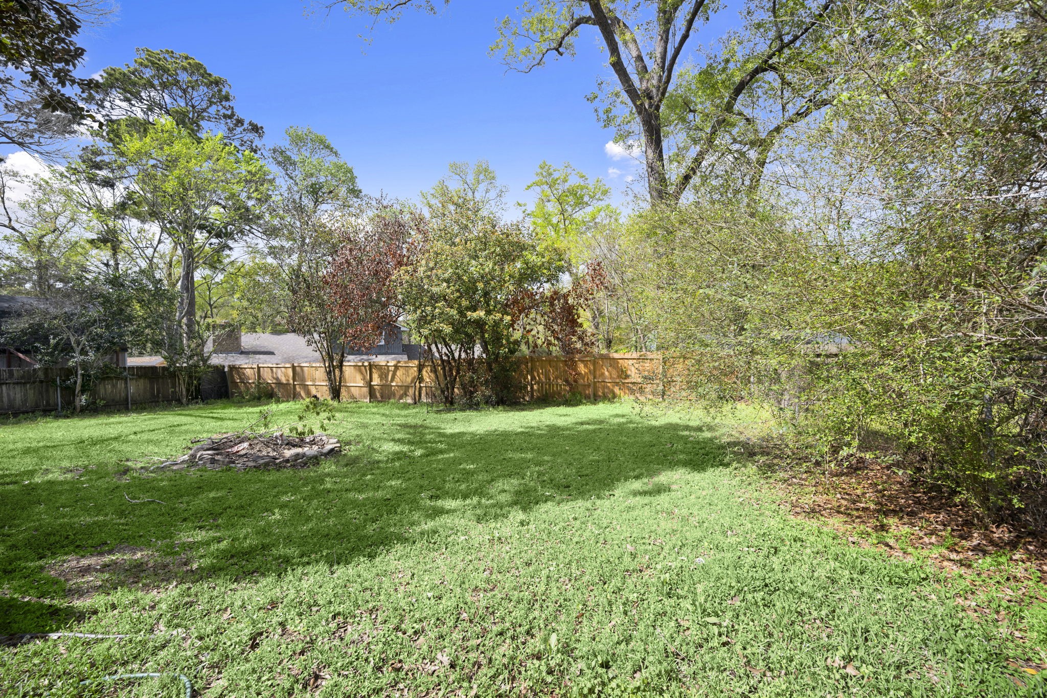 3414 Rustling Pines Street Spring, TX 77380 - Photo 25 of 26 a view of a backyard with garden