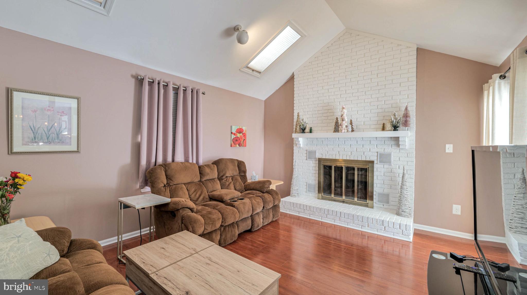 68 Wayside Road Berlin, NJ 08009 - Photo 14 of 31 a living room with furniture and a fireplace