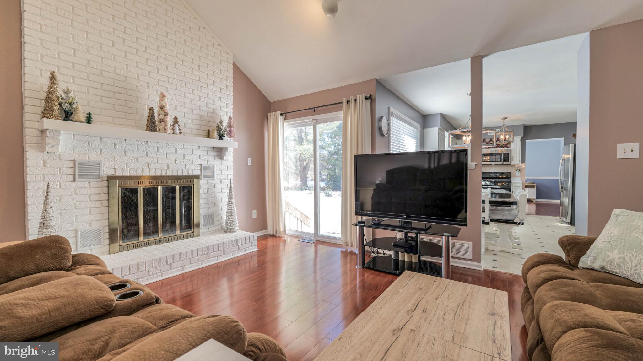 68 Wayside Road Berlin, NJ 08009 - Photo 15 of 31 a living room with furniture and a flat screen tv