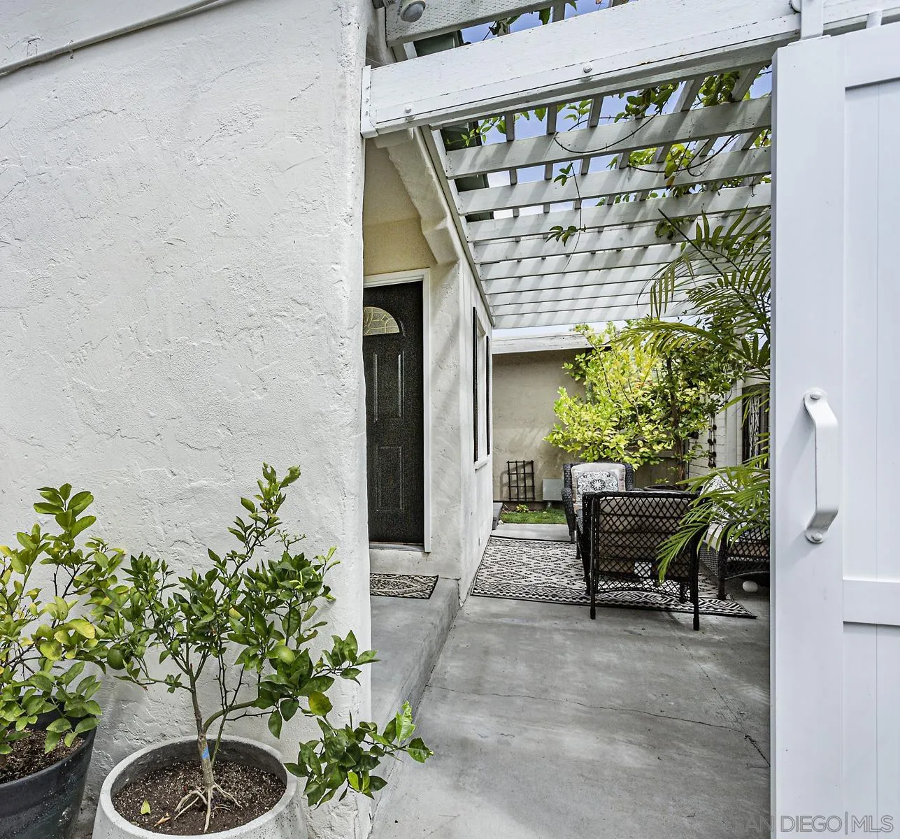 804 Vanderbilt Place San Diego, CA 92103 - Photo 7 of 18 a garden with a table and chairs in patio