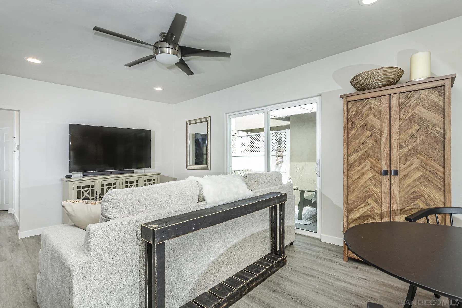 804 Vanderbilt Place San Diego, CA 92103 - Photo 8 of 18 a living room with furniture and a flat screen tv