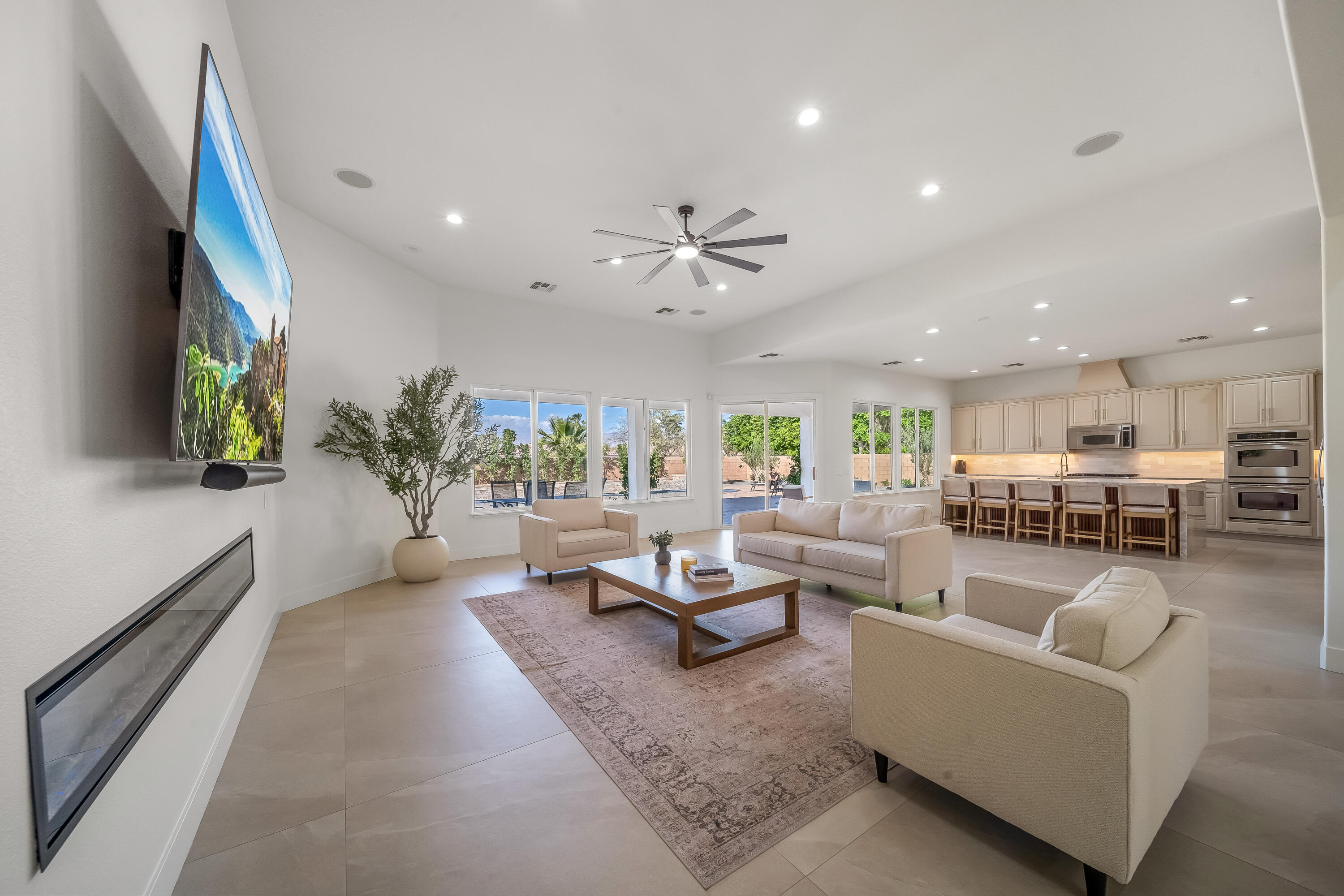 80262 Amazon Avenue Indio, CA 92201 - Photo 25 of 69 a living room with furniture kitchen view and a large window