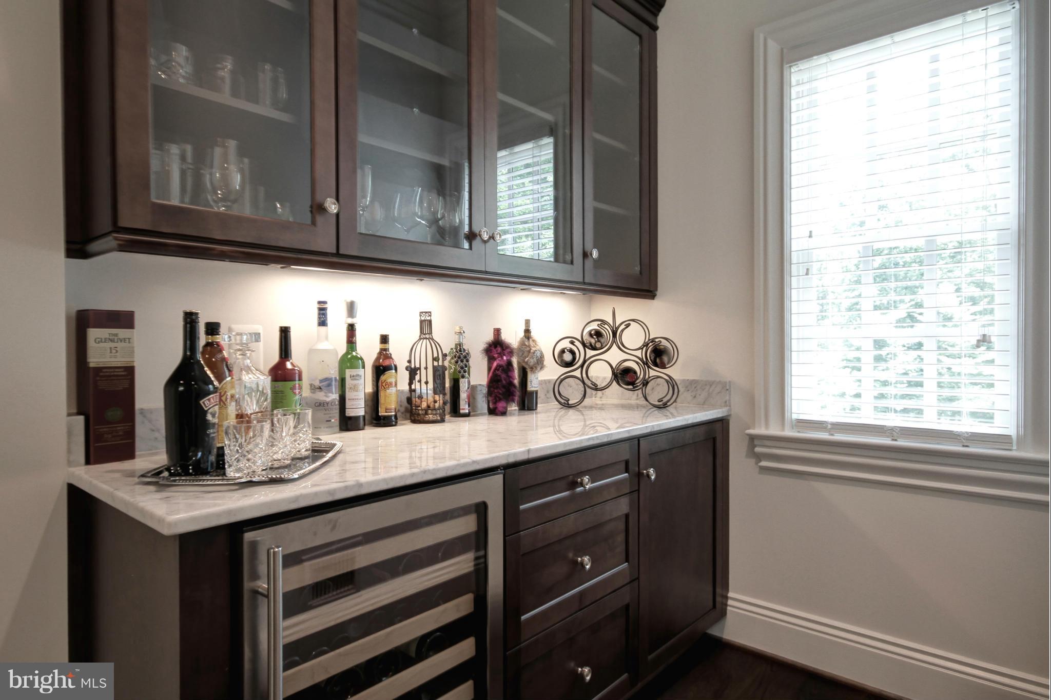 448 Springvale Road Great Falls, VA 22066 - Photo 13 of 30 a kitchen with granite countertop cabinets and window