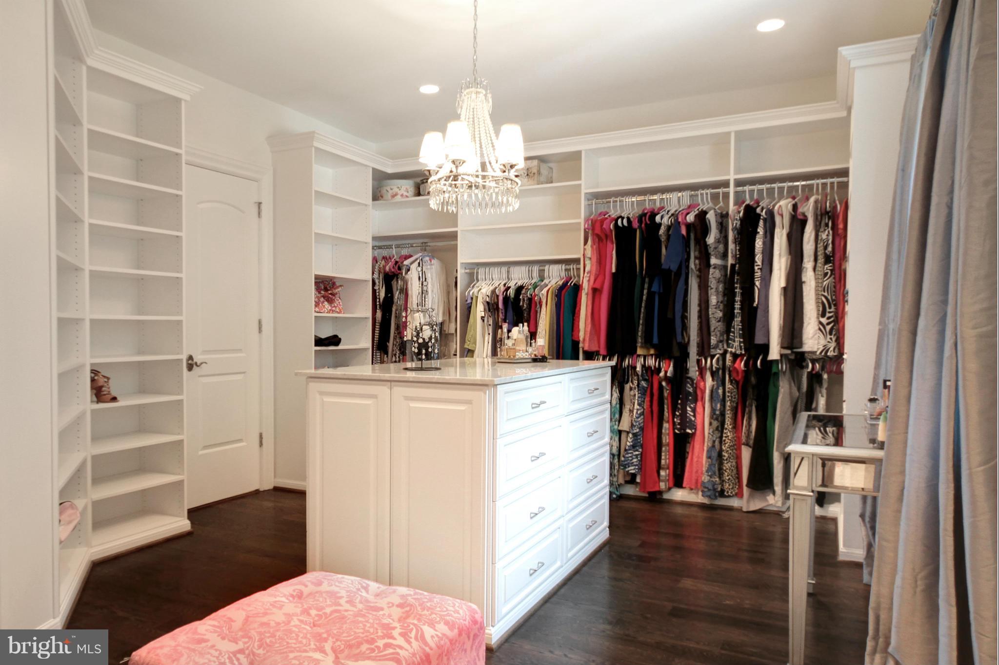 448 Springvale Road Great Falls, VA 22066 - Photo 15 of 30 a view of a walk in closet with clothes and shoes