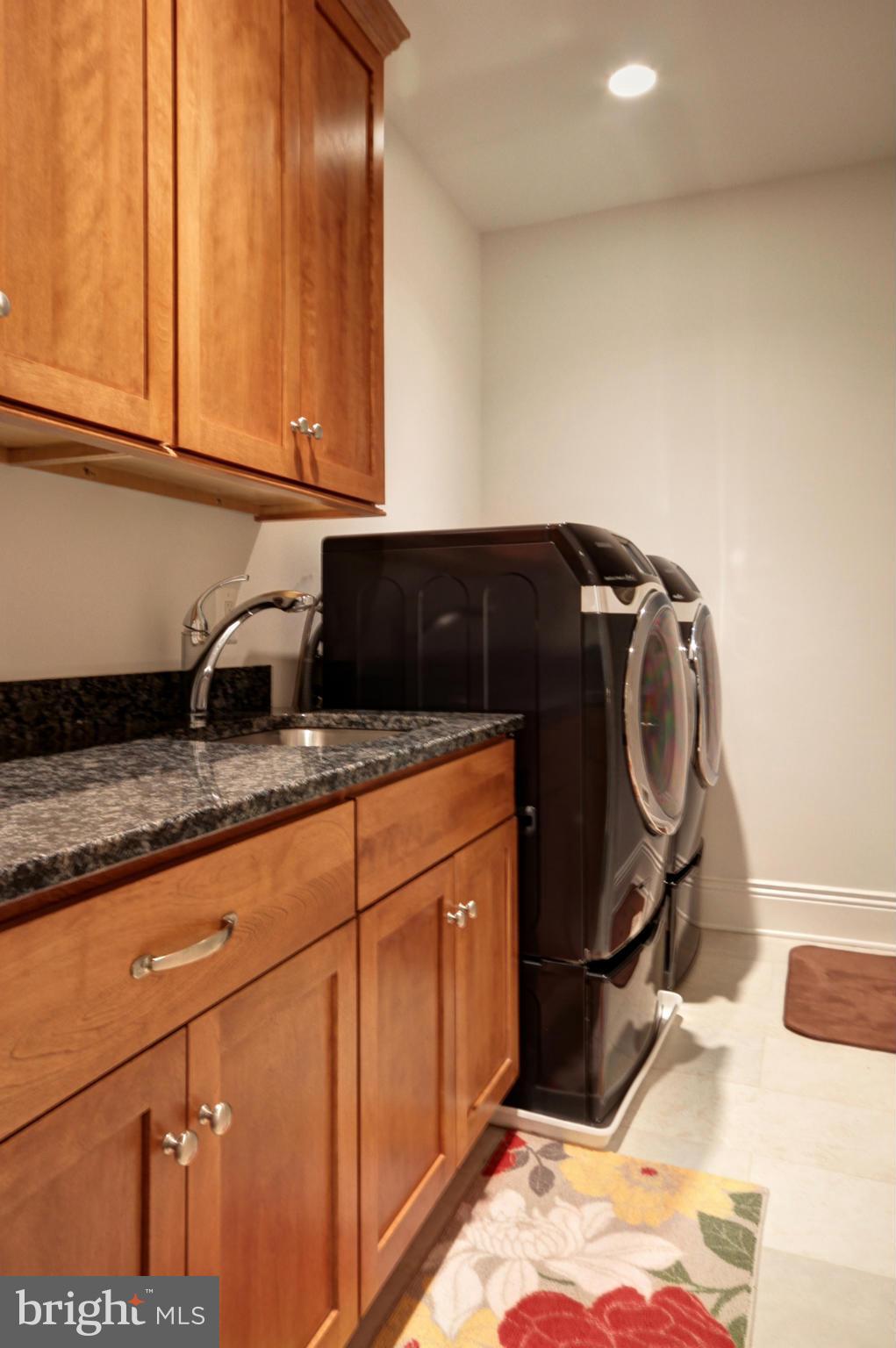 448 Springvale Road Great Falls, VA 22066 - Photo 21 of 30 a utility room with granite countertop cabinets and sink