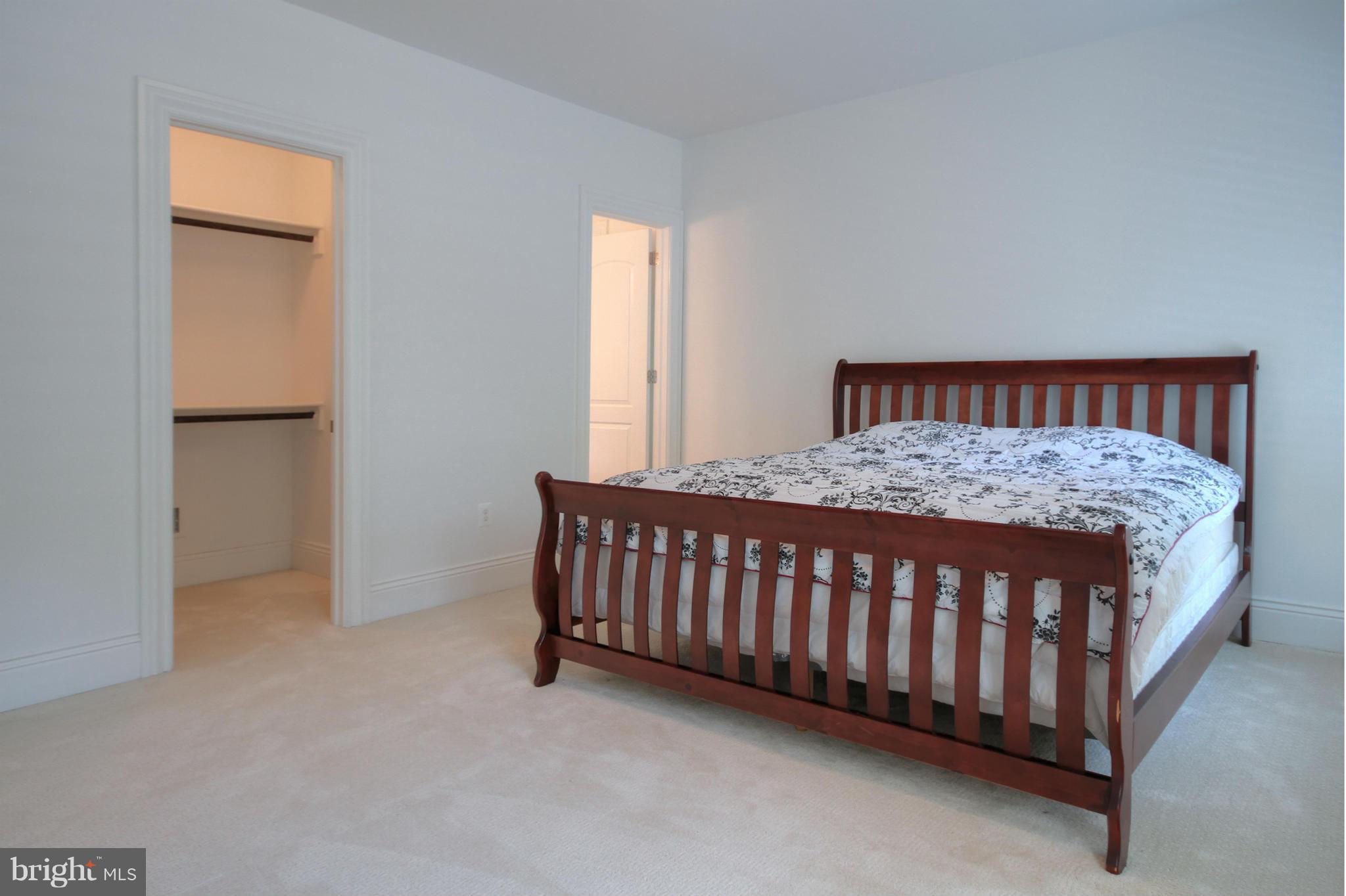 448 Springvale Road Great Falls, VA 22066 - Photo 24 of 30 a bedroom with a bed and a window