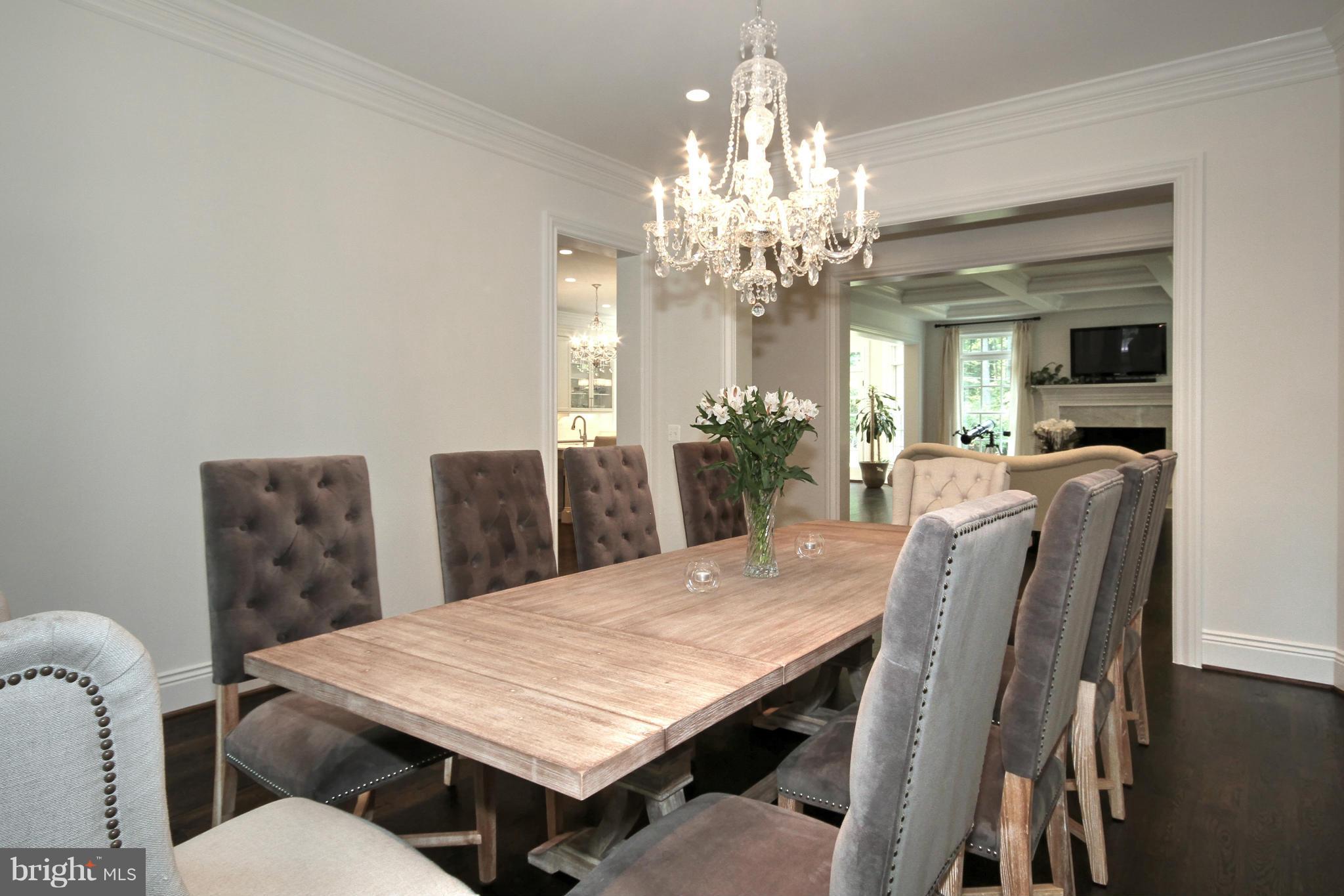 448 Springvale Road Great Falls, VA 22066 - Photo 4 of 30 a view of a dining room with furniture a chandelier and wooden floor