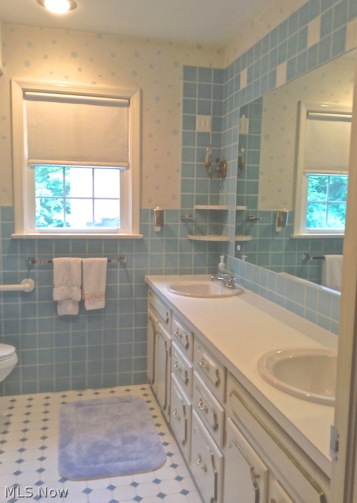 2063 Burlington Road Akron, OH 44313 - Photo 22 of 24 2nd full bath on second floor features double sinks and lots of storage.