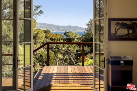 a view of balcony with furniture