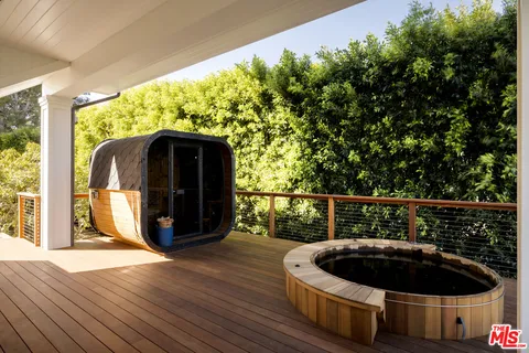 a swimming pool with outdoor seating and yard