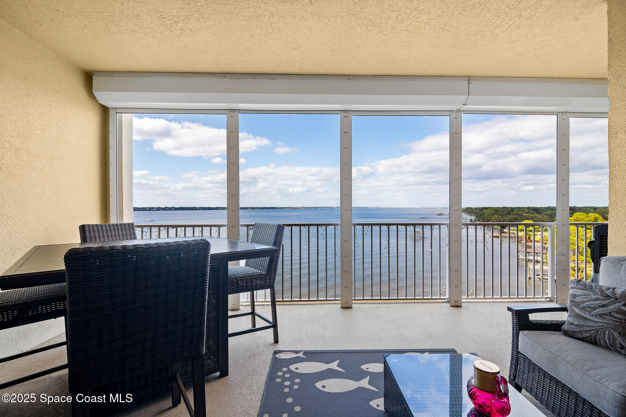 480 Sail Lane, Unit 703 Merritt Island, FL 32953 - Photo 1 of 41 a view of a living room and a floor to ceiling window