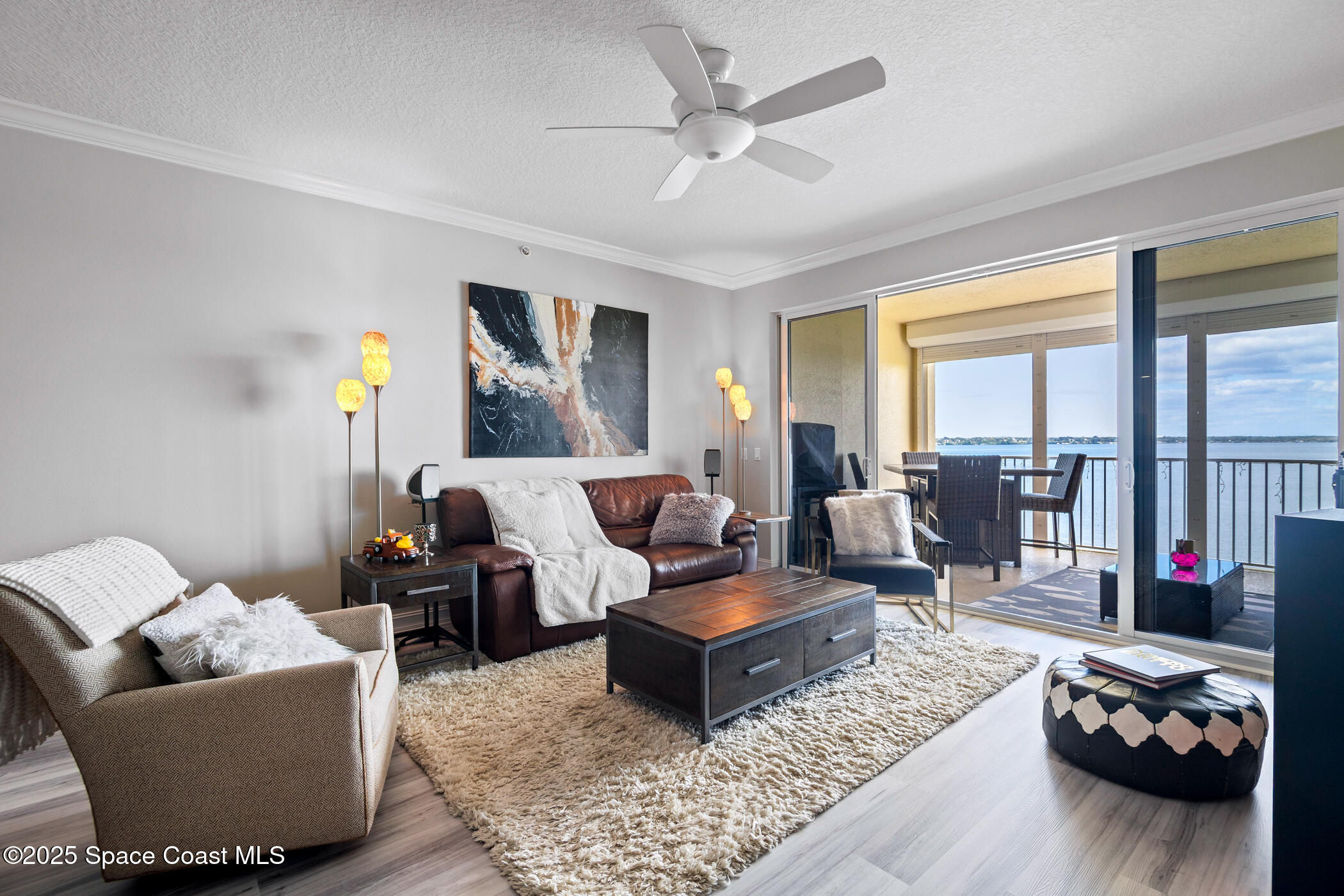 480 Sail Lane, Unit 703 Merritt Island, FL 32953 - Photo 14 of 41 a living room with furniture or couch and a window