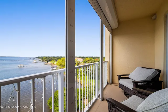 a view of a balcony with chairs
