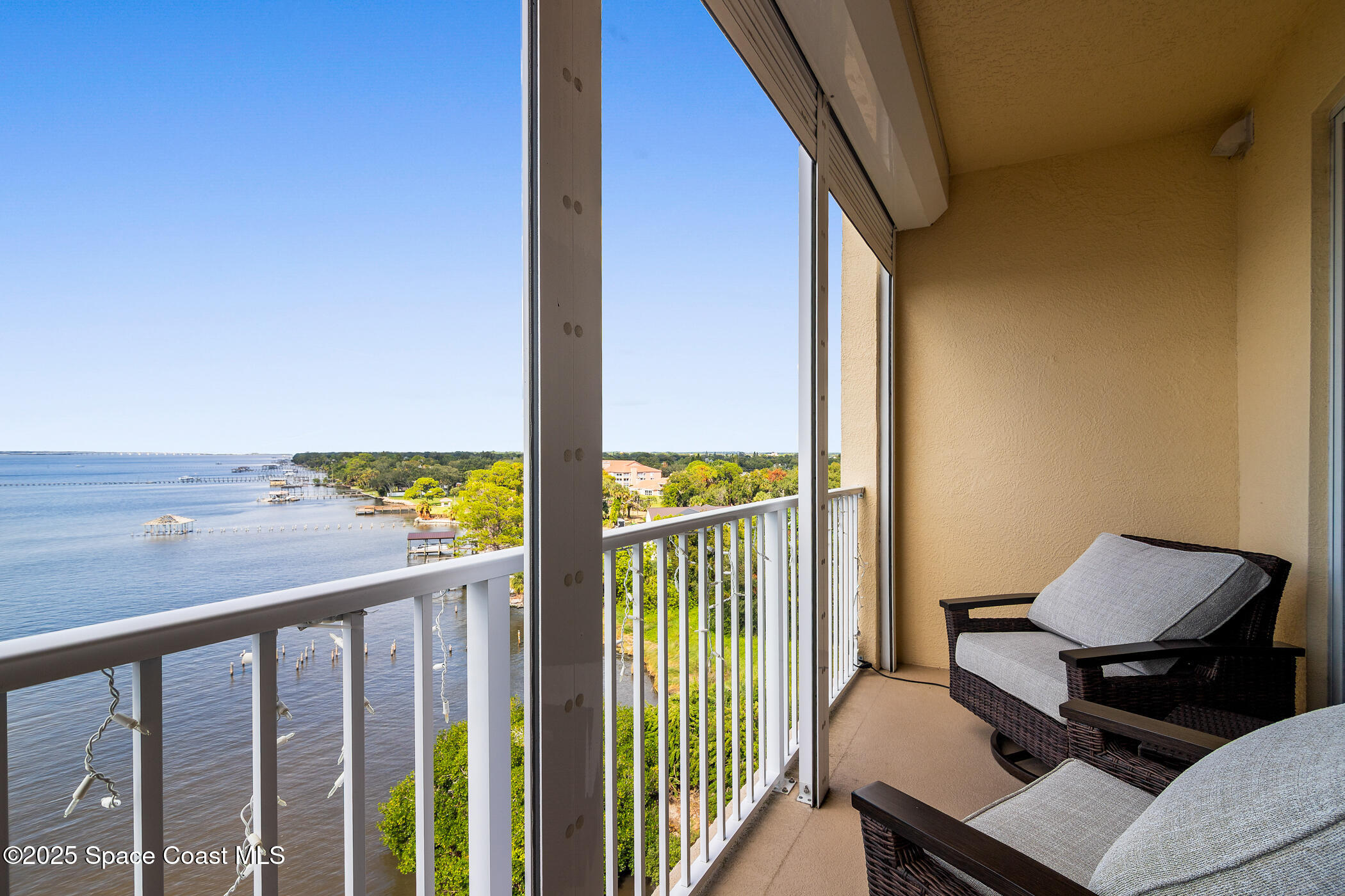 480 Sail Lane, Unit 703 Merritt Island, FL 32953 - Photo 18 of 41 a view of a balcony with chairs