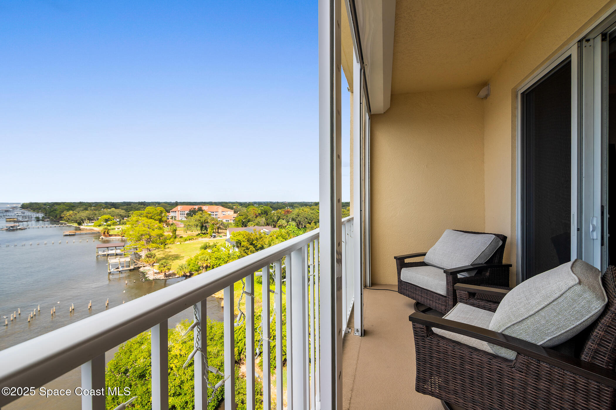480 Sail Lane, Unit 703 Merritt Island, FL 32953 - Photo 20 of 41 a view of a balcony with chairs