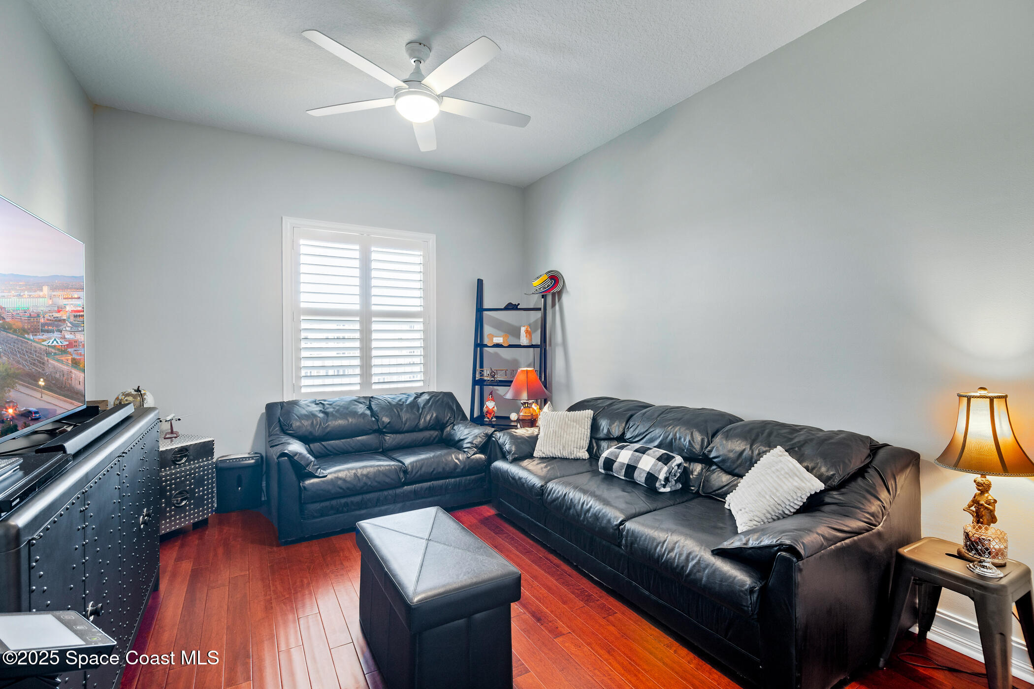 480 Sail Lane, Unit 703 Merritt Island, FL 32953 - Photo 21 of 41 a living room with furniture and a flat screen tv