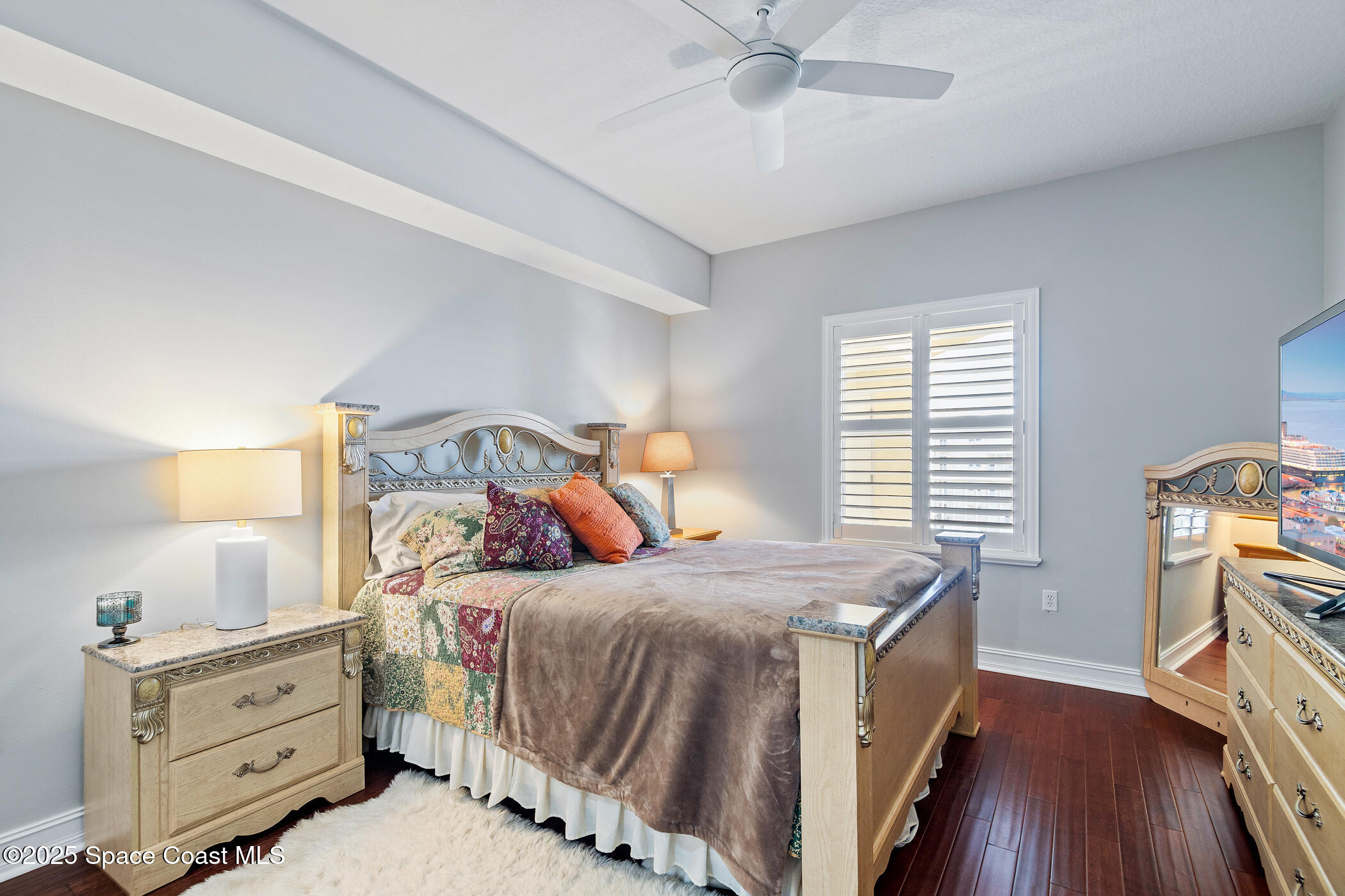 480 Sail Lane, Unit 703 Merritt Island, FL 32953 - Photo 22 of 41 a bedroom with a bed and a chandelier