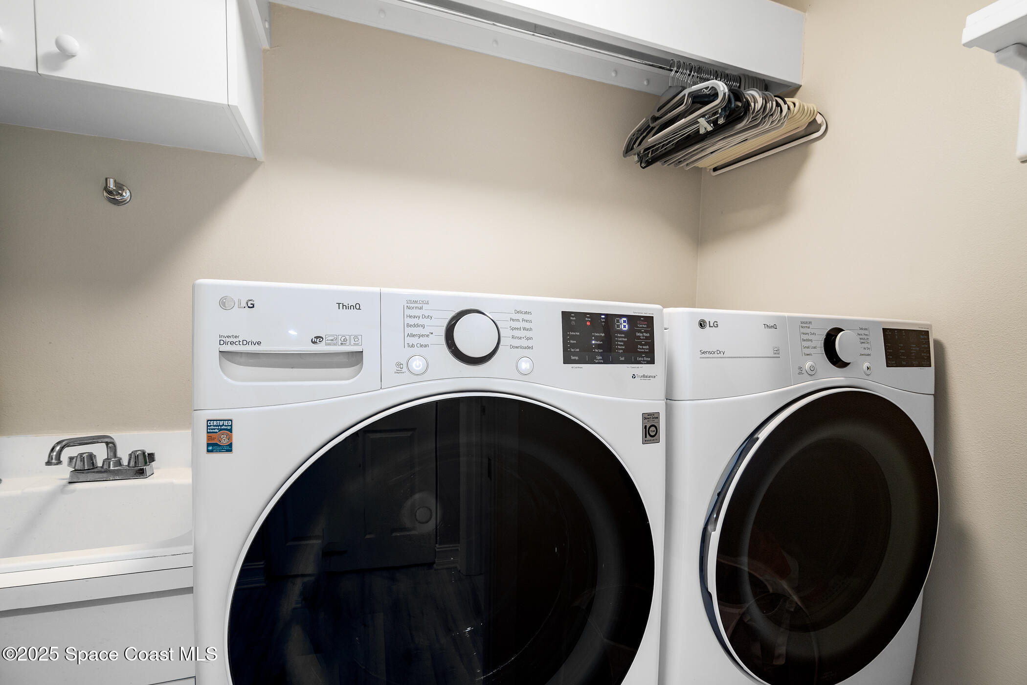 480 Sail Lane, Unit 703 Merritt Island, FL 32953 - Photo 23 of 41 a utility room with dryer and washer