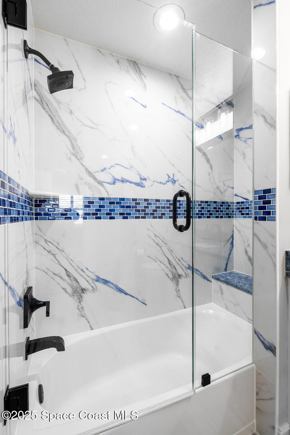 480 Sail Lane, Unit 703 Merritt Island, FL 32953 - Photo 24 of 41 a bathroom with a bathtub and a shower