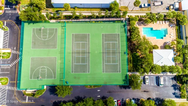 a room with gym equipment and windows