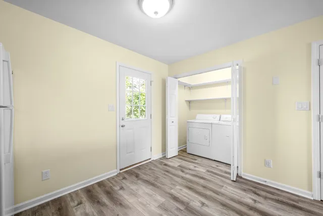 a view of an empty room and closet area