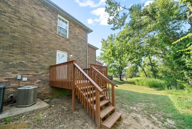 a view of a backyard with a deck