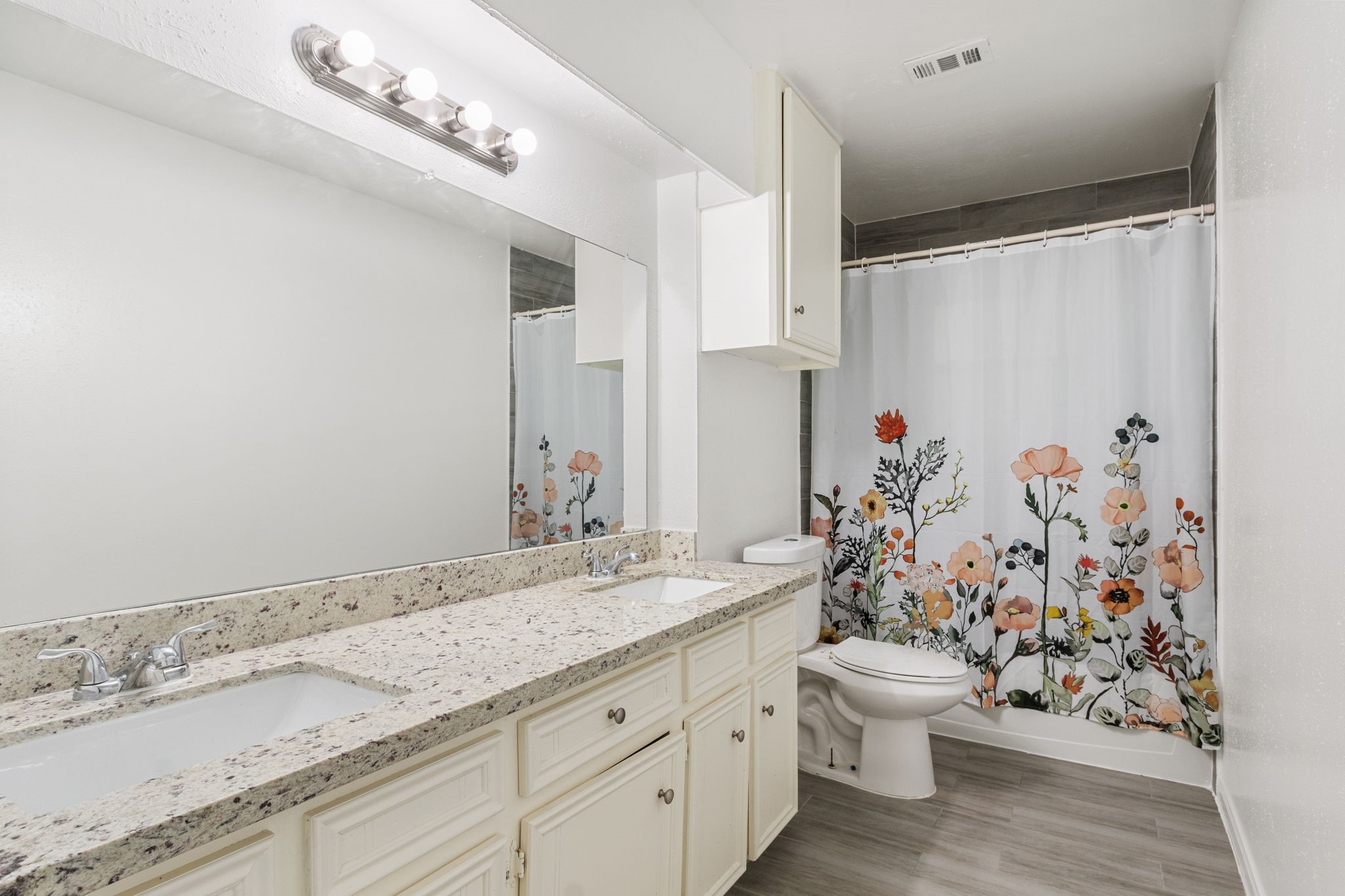 9726 John Bank Drive Spring, TX 77379 - Photo 29 of 36 Secondary bathroom with double sinks.