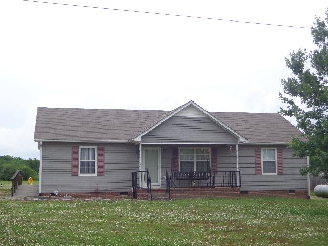 Detached garage located behind house that has a half bath. Lots of room to work.