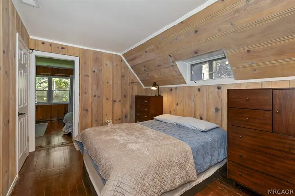 a bedroom with a bed and a cabinets