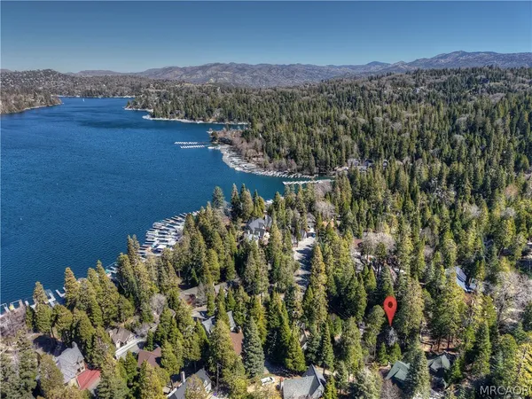 an aerial view of a house with a lake view