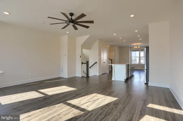 a view of a living room and wooden floor