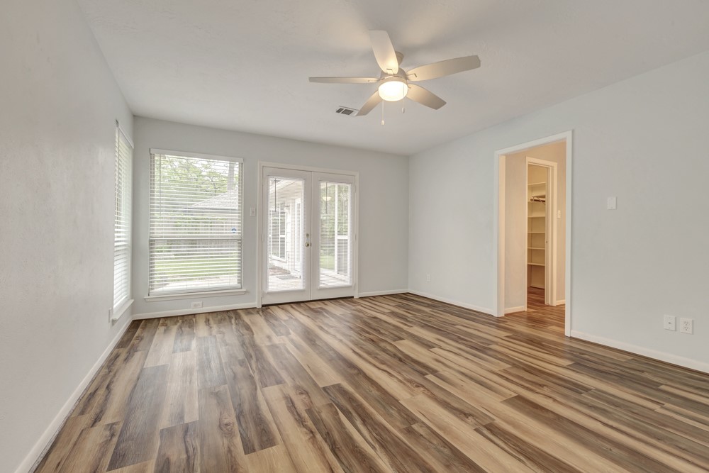 17 Wishbonebush Road Spring, TX 77380 - Photo 12 of 36 a view of an empty room with wooden floor and window