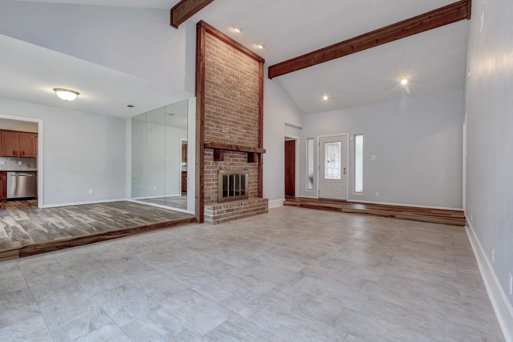 17 Wishbonebush Road Spring, TX 77380 - Photo 17 of 36 a view of an empty room with staircase and kitchen view