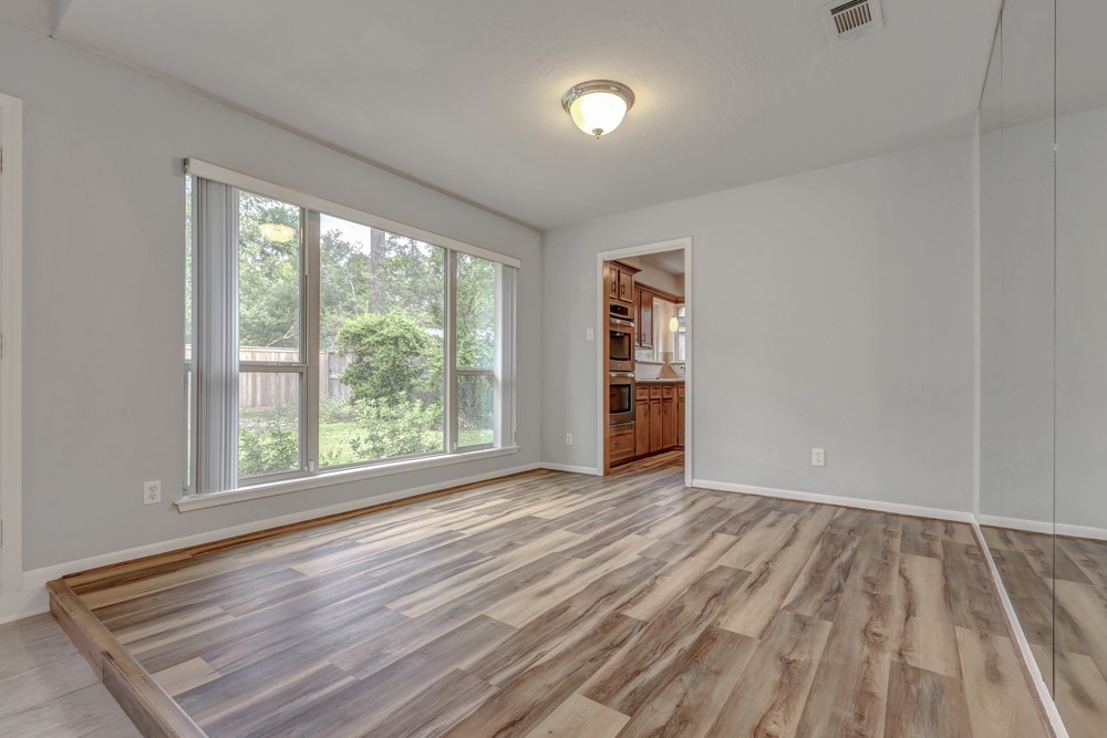 17 Wishbonebush Road Spring, TX 77380 - Photo 20 of 36 an empty room with wooden floor and a window