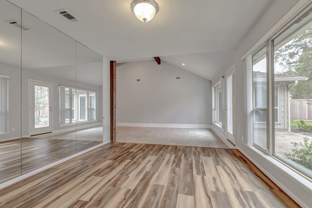 17 Wishbonebush Road Spring, TX 77380 - Photo 21 of 36 a view of empty room with wooden floor and fan