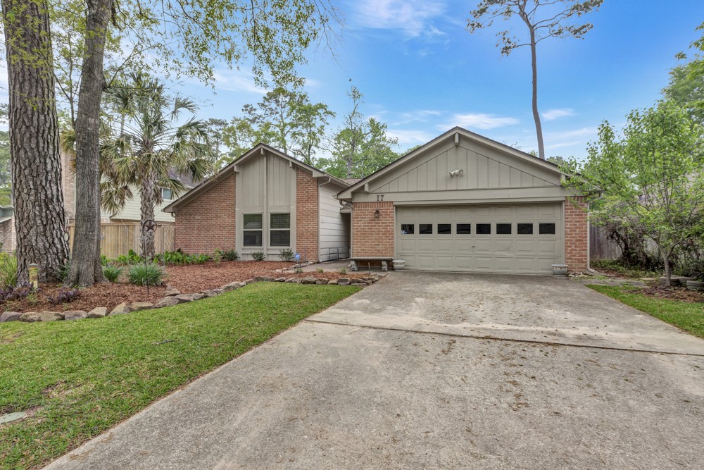 17 Wishbonebush Road Spring, TX 77380 - Photo 3 of 36 a view of a house with a yard