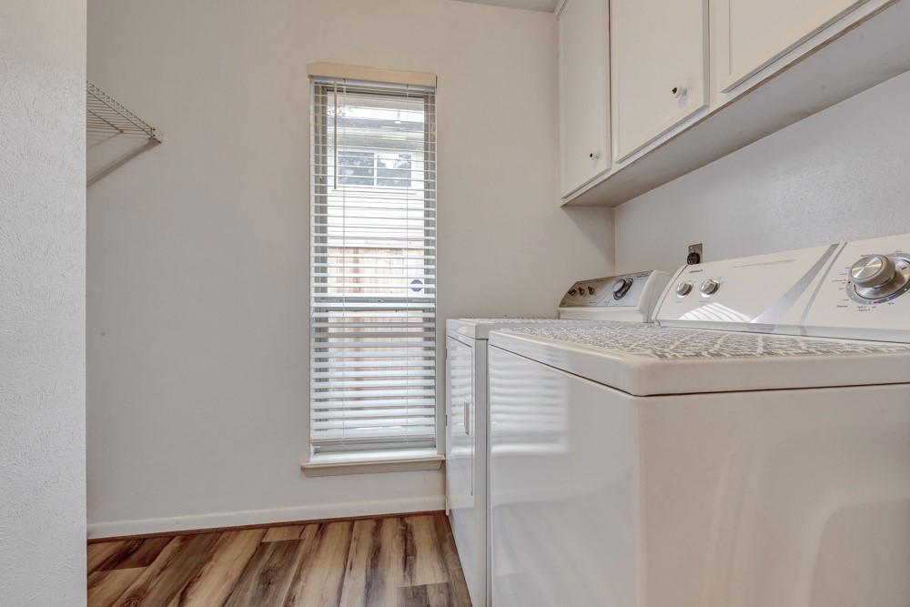 17 Wishbonebush Road Spring, TX 77380 - Photo 6 of 36 a bathroom with a sink and washing machine