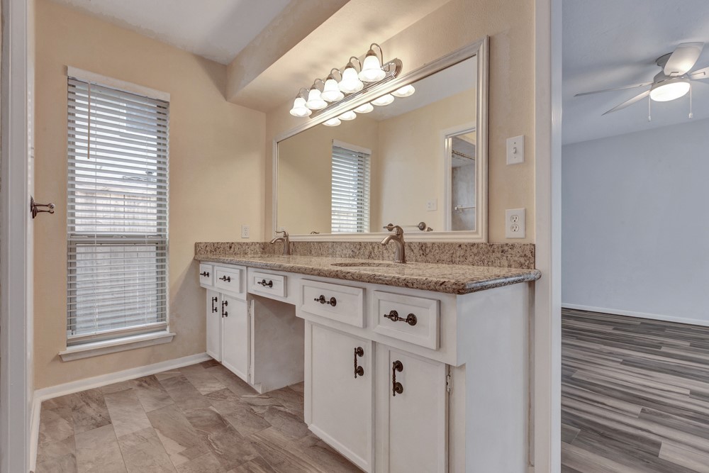 17 Wishbonebush Road Spring, TX 77380 - Photo 8 of 36 a bathroom with a granite countertop sink and a mirror