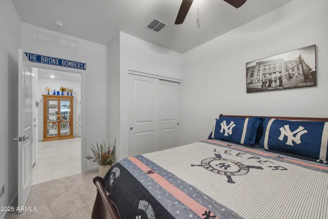 a view of a bedroom with a bed and a couch