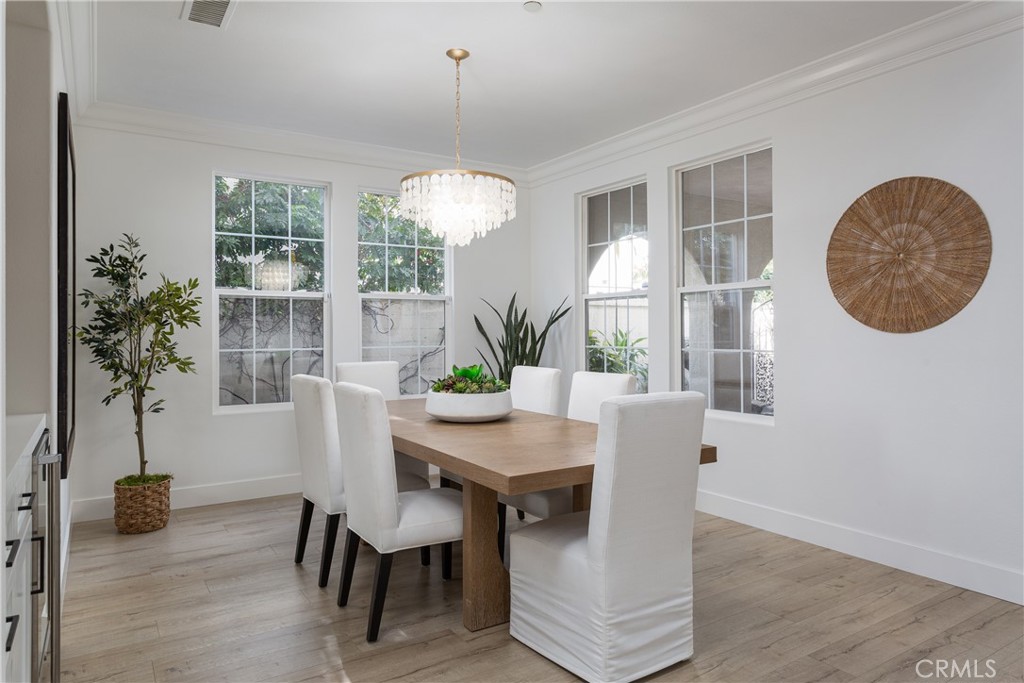 308 Via Los Tilos San Clemente, CA 92673 - Photo 16 of 43 a view of a dining room with furniture wooden floor and chandelier